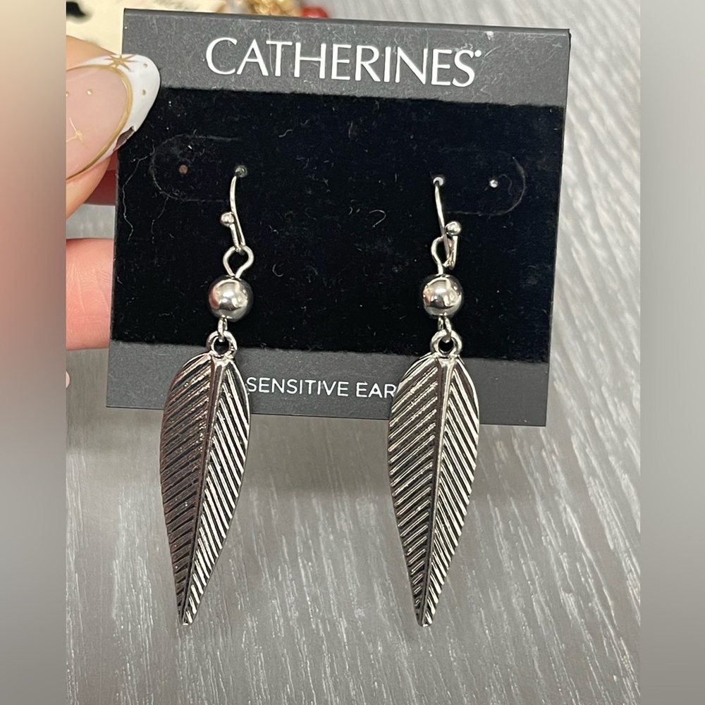 Catherine’s silver dangle feather pierced earrings